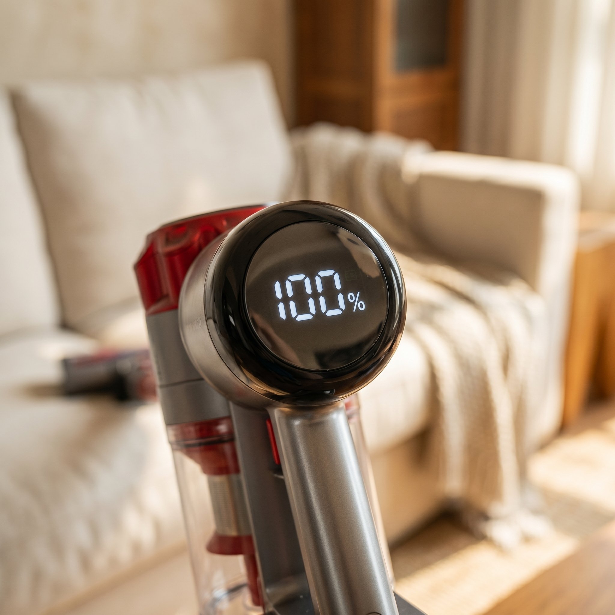 The Nyven vacuum's digital display shows a 100% battery indicator.
